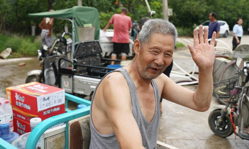 A villager who has been evacuated to a settlement site prepares to return to his home after receiving relief supplies in Koutou Village of Qinglonghu Town in Fangshan District of Beijing, capital of China, Aug. 5, 2023. As this round of typhoon-induced torrential rains have come to an end in Beijing, some villagers of Fangshan District, who had been evacuated to settlement sites due to heavy rainfall over the previous few days, returned home on Saturday after experts assessed the safety of their residences.

Beijing has, over the past few days, seen the heaviest rainfall since records began 140 years ago. (Xinhua/Zhang Chenlin)