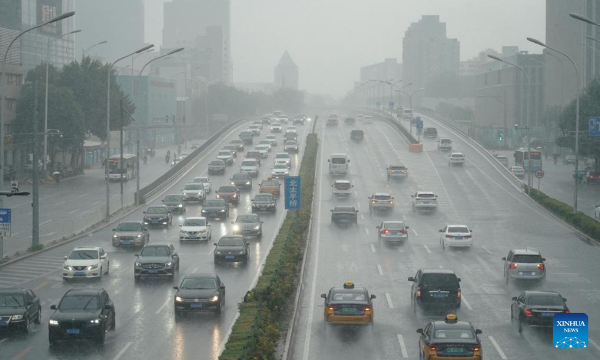 Vehicles move in the rain on a road in Haidian District, Beijing, capital of China, on July 29, 2023. Impacted by Typhoon Doksuri, the fifth typhoon of this year, heavy rainfall has hit regions in northern China, including Beijing, Hebei and Shandong. Photo:Xinhua