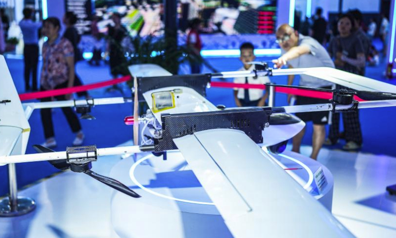 People visit the venue of the first Guizhou Science and Technology Festival in Guiyang, southwest China's Guizhou Province, Aug. 5, 2023. The first Guizhou Science and Technology Festival kicked off at Guiyang International Conference and Exhibition Center on Saturday and will last till Aug. 9. (Xinhua/Tao Liang)