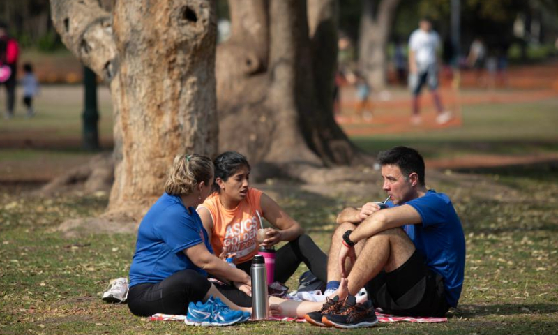 People enjoy leisure time at a park during winter time in Buenos Aires, Argentina, Aug. 6, 2023. (Photo by Martin Sabala/Xinhua)