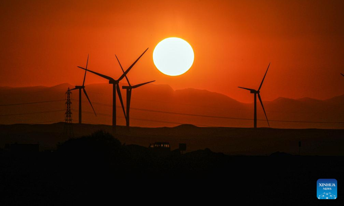 Wind turbines are silhouetted against the sunset in Hurghada, Egypt, on Aug 4, 2023. Photo:Xinhua