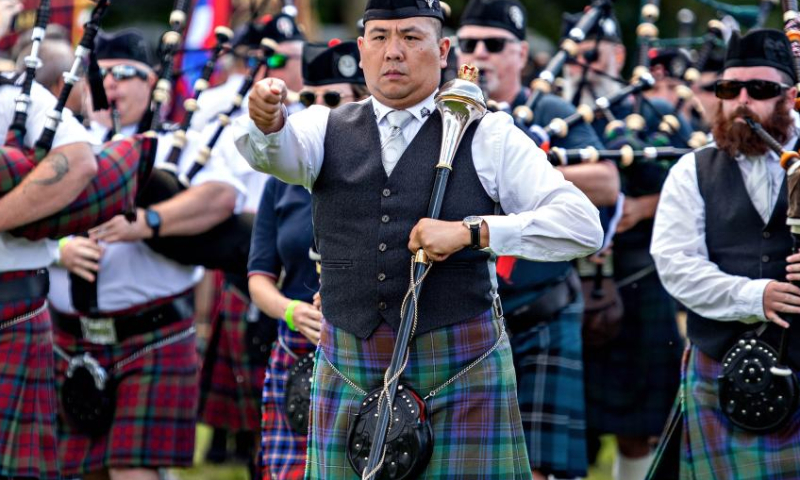 People play traditional musical instruments during the 2023 Montreal Highland Games in Montreal, Canada, on Aug. 6, 2023. The 2023 Montreal Highland Games were held here Sunday. The games, held annually during summers since 1855, feature traditional Scottish events that include pipe bands, athletes and Highland dancers. (Photo by Andrew Soong/Xinhua)