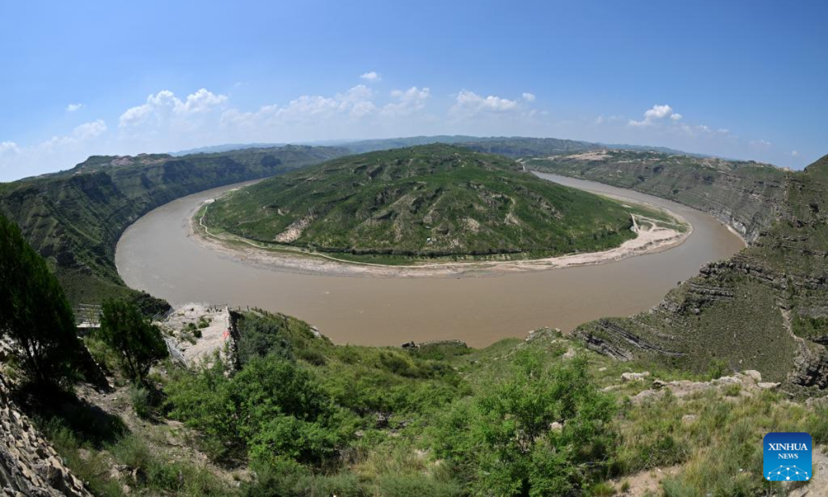 This aerial photo taken on Aug 3, 2023 shows a scene of a turning of the Yellow River in the border area between Shilou County of north China's Shanxi Province and Qingjian County of northwest China's Shaanxi Province. Photo:Xinhua