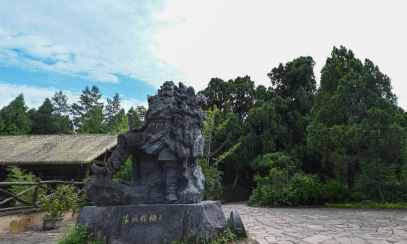 This photo taken on July 24, 2023 shows a statue with a theme of ancient cypress trees in the Cuiyunlang section of an ancient road system known as Shudao in Jiange County of Guangyuan City, southwest China's Sichuan Province. The ancient cypress trees along the Cuiyunlang section of Shudao boast an average age of 1,050 years, with the oldest tree dating back approximately 2,300 years.

Presently, the Cuiyunlang section proudly harbors 7,803 ancient trees, with a staggering 7,778 being ancient cypress trees. (Xinhua/Wang Xi)