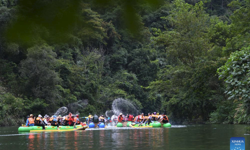 Visitors experience drifting at the Dongjiang Lake scenic spot in Zixing City, central China's Hunan Province, July 27, 2023. (Xinhua/Zhao Zhongzhi)