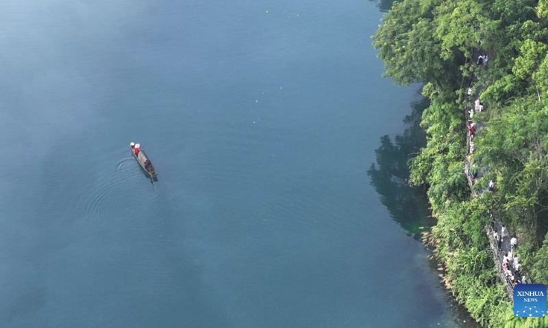 This aerial photo taken on July 26, 2023 shows people visiting the Dongjiang Lake scenic spot in Zixing City, central China's Hunan Province. (Xinhua/Zhao Zhongzhi)