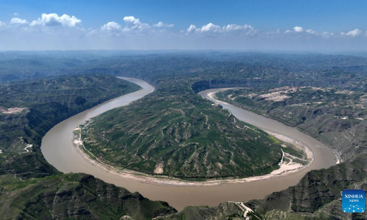 This aerial photo taken on Aug 3, 2023 shows a scene of a turning of the Yellow River in the border area between Shilou County of north China's Shanxi Province and Qingjian County of northwest China's Shaanxi Province. Photo:Xinhua