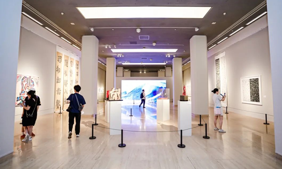 Visitors explore the exhibition. Photo: Courtesy of National Art Museum of China