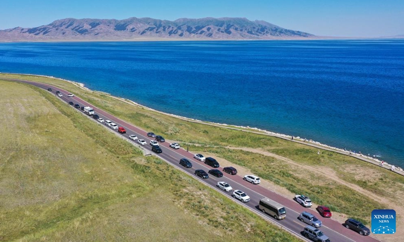 This aerial photo taken on July 25, 2023 shows vehicles waiting to enter the Sayram Lake scenic area in Bortala Mongolian Autonomous Prefecture, northwest China's Xinjiang Uygur Autonomous Region. (Xinhua/Ding Lei)