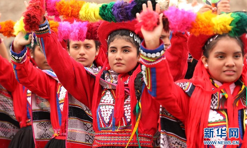 People dressed in traditional costumes take part in a local traditional event in the Peruvian capital, Lima.(Photo:Xinhua)