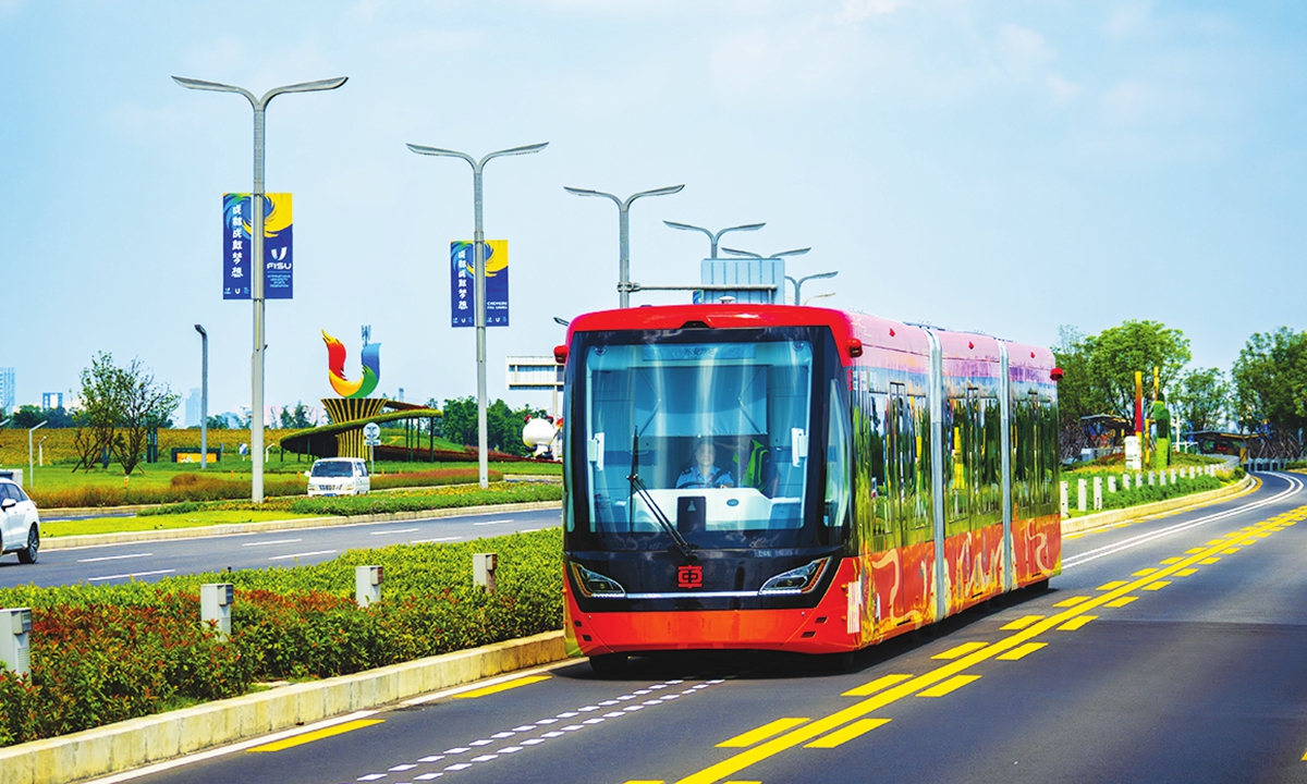 A bus with the world's first Autonomous Rail Rapid Transit system runs in Chengdu on July 30 to serve the Chengdu University Games. Photo: VCG