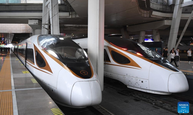 A train operating on the Beijing-Tianjin Intercity Railway (L) waits for passengers at the Beijing South Railway Station in Beijing, capital of China, Aug. 1, 2023. The Beijing-Tianjin Intercity Railway celebrated its 15th anniversary of opening Tuesday. As the first high-speed railway (HSR) with a design speed of 350 km per hour in China, the Beijing-Tianjin Intercity Railway carried a total of 340 million passengers since it entered operation.(Photo: Xinhua)