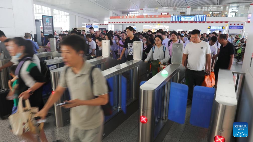 Passengers pass through ticket gates at Xuzhou East Railway Station in Xuzhou, east China's Jiangsu Province, Aug. 1, 2023. China's railways recorded 406 million passenger trips from July 1 to 31, according to data revealed on Tuesday by China State Railway Group Co., Ltd., the country's railway operator. During this period, daily passenger trips averaged 13.1 million, while 10,169 trains were operating daily, up 14.2 percent compared to the same period in 2019, according to the company.(Photo: Xinhua)