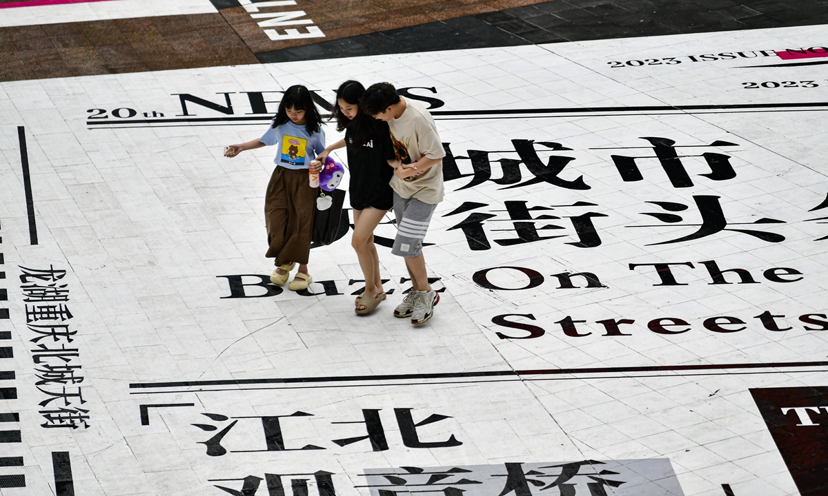 A multi-colored zebra crossing in Guanyinqiao, Southwest China's Chongqing Municipality, becomes popular among citizens on August 1, 2023. In the middle of the zebra crossing, there is a giant 