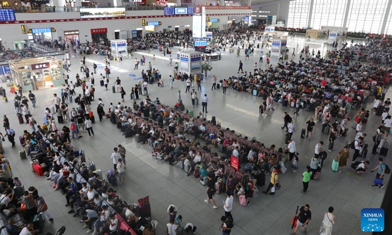 Passengers wait for trains at the waiting hall of Xuzhou East Railway Station in Xuzhou, east China's Jiangsu Province, Aug. 1, 2023. China's railways recorded 406 million passenger trips from July 1 to 31, according to data revealed on Tuesday by China State Railway Group Co., Ltd., the country's railway operator. (Photo: Xinhua)