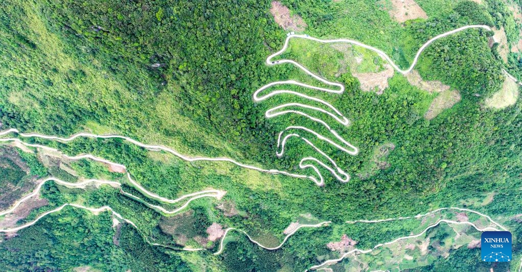 This aerial photo taken on July 31, 2023 shows a winding mountain road in Napo County, south China's Guangxi Zhuang Autonomous Region. Napo County belongs to the mountainous areas of Guangxi. In recent years, several winding mountain roads have been built to make it more convenient for local villagers to travel and to promote local economic growth at the same time.(Photo: Xinhua)