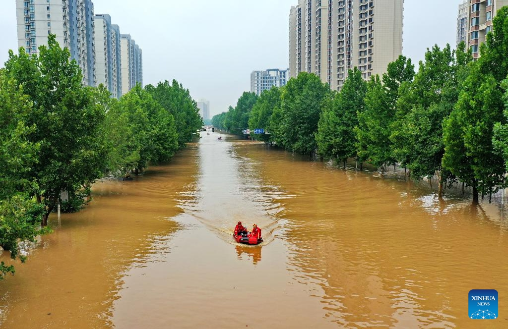 This aerial photo taken on Aug. 2, 2023 shows rescuers heading to transfer flood-trapped people in Zhuozhou, north China's Hebei Province. Nine people have died and six are missing in north China's Hebei Province as of noon on Tuesday as rainstorms continue, local authorities have said. Statistics show that rainstorms had impacted a total of 540,703 people in 87 counties and districts in Hebei by noon on Tuesday.(Photo: Xinhua)