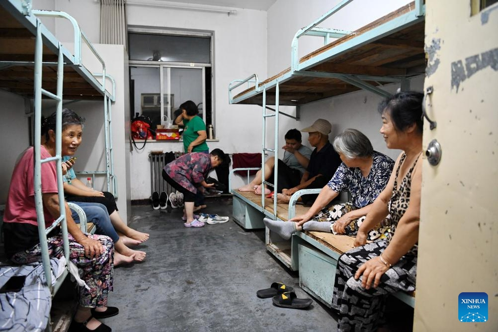 Evacuated residents rest at a temporary shelter in Zhuozhou, north China's Hebei Province, Aug. 1, 2023. Nine people have died and six are missing in north China's Hebei Province as of noon on Tuesday as rainstorms continue, local authorities have said. Statistics show that rainstorms had impacted a total of 540,703 people in 87 counties and districts in Hebei by noon on Tuesday.(Photo: Xinhua)