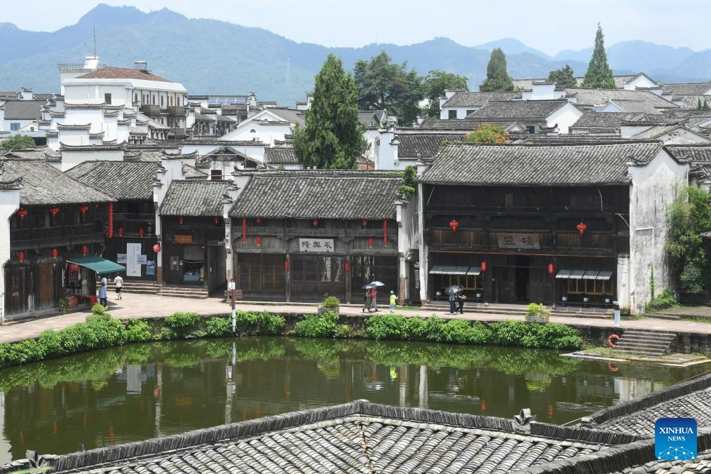 Tourists visit the Zhuge Village of Lanxi City, east China's Zhejiang Province, Aug. 1, 2023. The Zhuge Village, a historic gem with over 300 ancient buildings dating back to Ming and Qing dynasties (1368-1911), is home to descendents of Zhuge Liang, a renowned military strategist in the Three Kingdom Period (220-280). The village has made concerted efforts to preserve the ancient heritages and develop tourism, receiving over 500,000 visitors annually.(Photo: Xinhua)