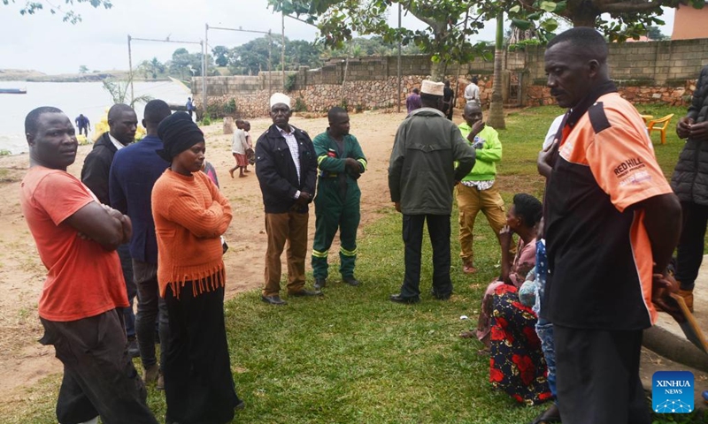 Relatives of victims of a boat capsizing accident wait at Kasenyi landing site, Wakiso District, Uganda, Aug. 3, 2023. At least 20 people were killed after a boat capsized in Lake Victoria in central Uganda, police said Wednesday. (Photo: Xinhua)