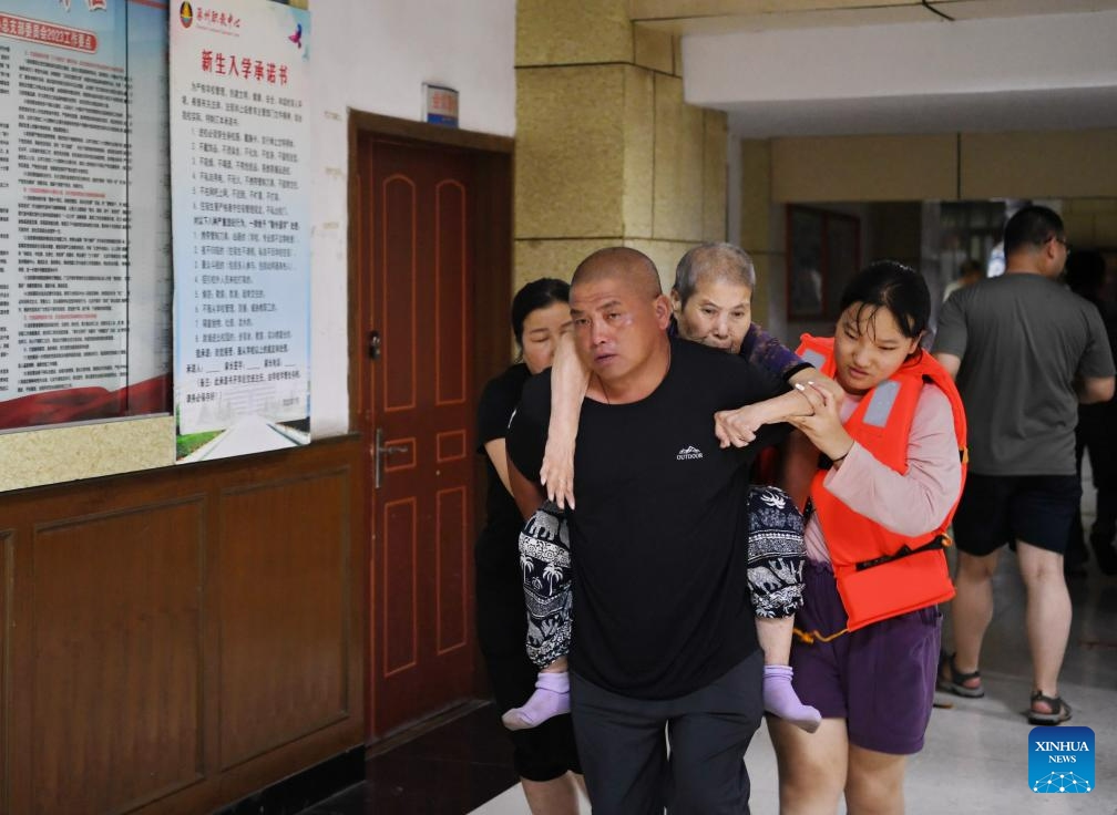 Evacuated residents enter a temporary shelter in Zhuozhou, north China's Hebei Province, Aug. 1, 2023. Nine people have died and six are missing in north China's Hebei Province as of noon on Tuesday as rainstorms continue, local authorities have said. Statistics show that rainstorms had impacted a total of 540,703 people in 87 counties and districts in Hebei by noon on Tuesday.(Photo: Xinhua)