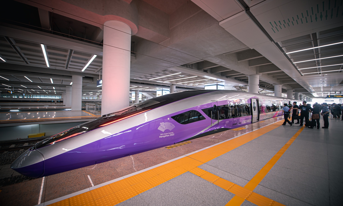 The Fuxing intelligent bullet train tailor-made the 19th Asian Games Hangzhou 2022 stops at the West Hangzhou Station on August 4, 2023 in East China's Zhejiang Province, with nearly 100 passengers on board for its first trial run. The train has been upgraded with technology adapted to better cater to Zhejiang's terrain, which will provide a more comfortable riding experience for passengers. Photo: Xinhua