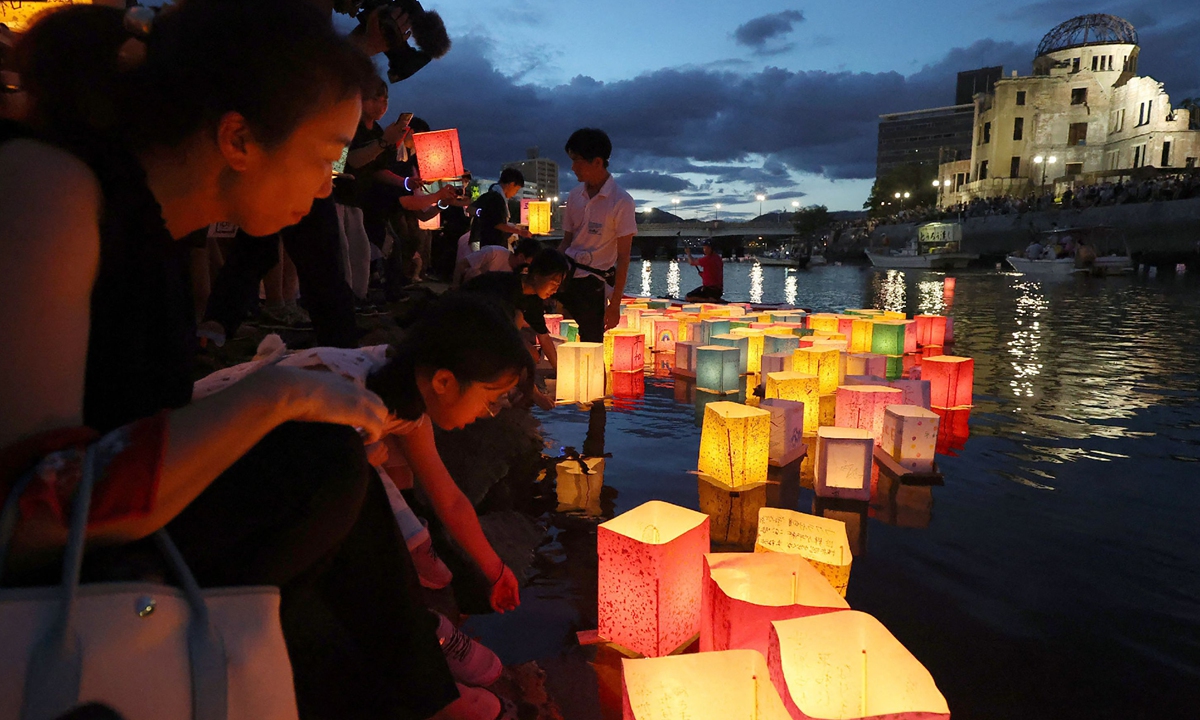 People release paper lanterns on the Motoyasu River beside Atomic Bomb Dome, originally the Hiroshima Prefectural Industrial Promotion Hall, on August 6, 2023, to mark the 78th anniversary of the atomic bombing of Hiroshima in 1945. Photo: VCG  