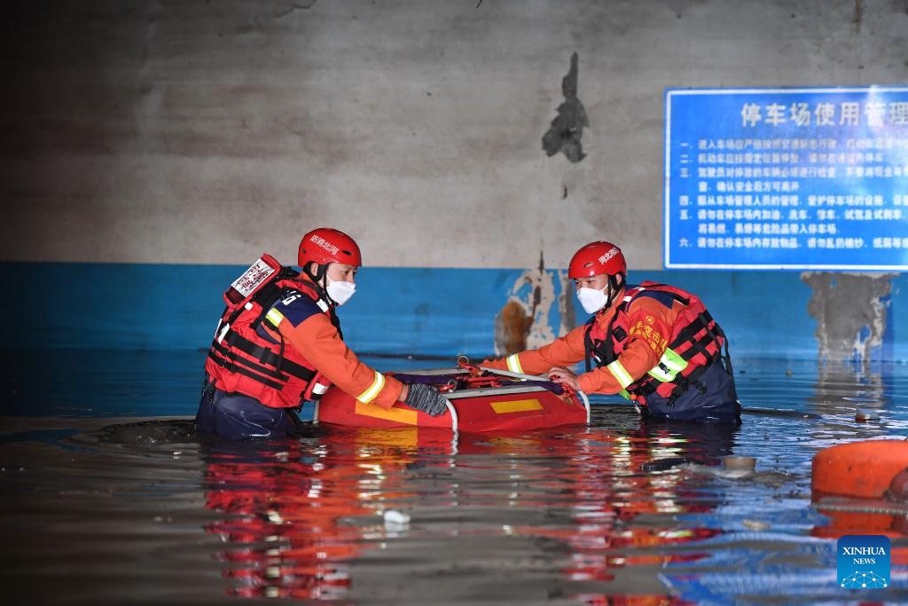 Rescuers perform drainage operation at an underground parking area in Zhuozhou, north China's Hebei Province, on Aug. 7, 2023. More than 800 rescuers redeployed from Tangshan, Handan, Hengshui and other cities of the province have been working around the clock in the most seriously flooded areas of Zhuozhou, trying to put life back to normal as soon as possible.(Photo: Xinhua)