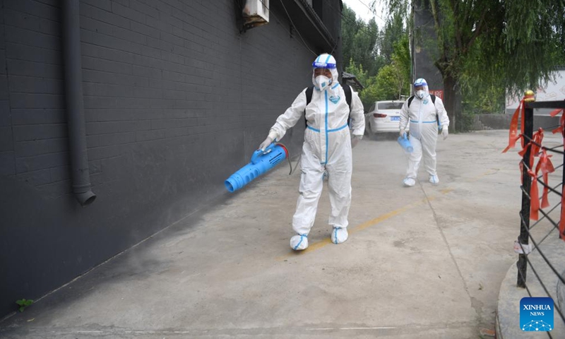 Sanitation workers conduct disinfection after flood in Zhongyidian Village of Zhuozhou City, north China's Hebei Province, Aug. 8, 2023. Zhuozhou is one of the worst-affected areas by heavy rainfall in Hebei. Currently, the city is busy dredging and disinfecting the surrounding environment to prevent possible disease spread as the floods recede.(Photo: Xinhua)