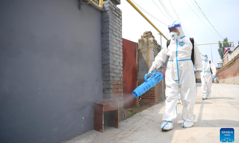 Sanitation workers conduct disinfection after flood in Zhongyidian Village of Zhuozhou City, north China's Hebei Province, Aug. 8, 2023. Zhuozhou is one of the worst-affected areas by heavy rainfall in Hebei. Currently, the city is busy dredging and disinfecting the surrounding environment to prevent possible disease spread as the floods recede.(Photo: Xinhua)