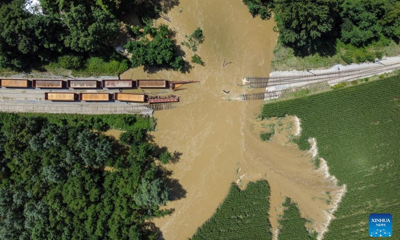 This aerial photo taken on Aug. 8, 2023 shows flooded railroads and sunken freight trains after heavy rainfall near Koprivnica, Croatia.(Photo: Xinhua)