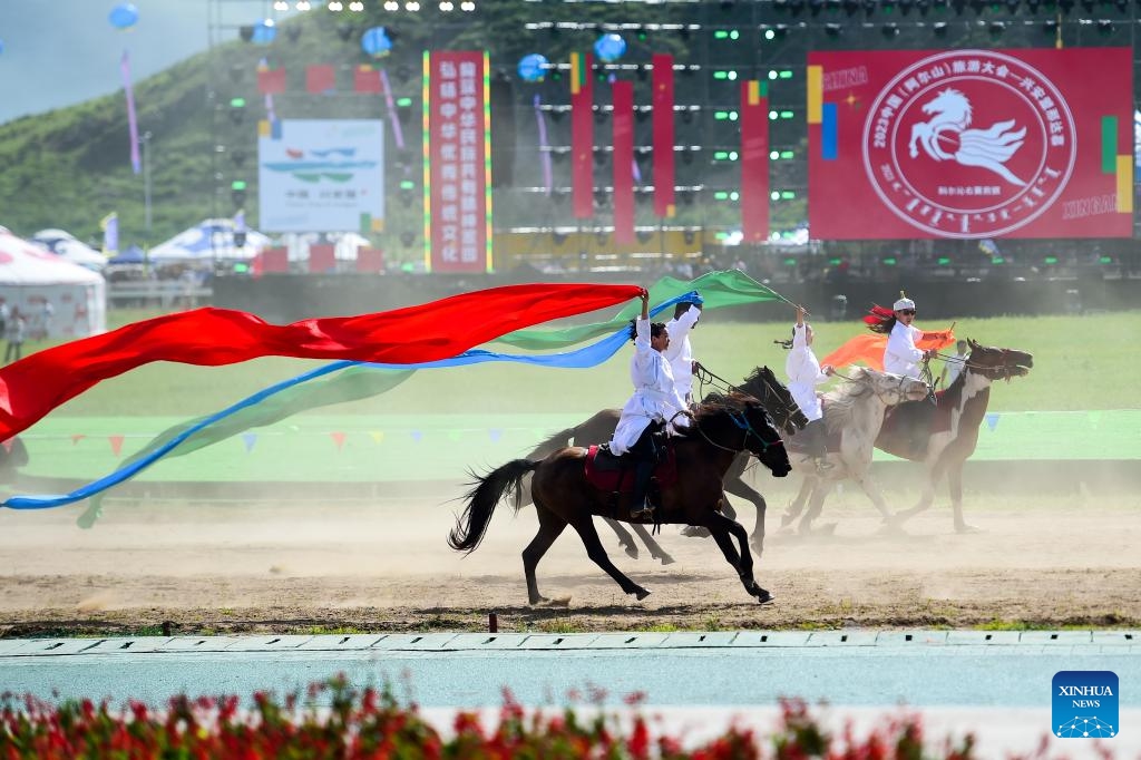 Performers ride at the opening ceremony of a Nadam fair in Horqin Right Wing Front Banner, Hinggan League, north China's Inner Mongolia Autonomous Region, Aug. 9, 2023. A Nadam fair kicked off here on Wednesday and will last till Aug. 12. A variety of activities as horse racing, wrestling competition, archery contest and music festival will be held during the event.(Photo: Xinhua)