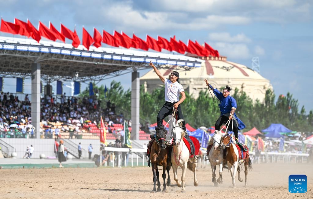 Actors perform at the opening ceremony of a Nadam fair in Horqin Right Wing Front Banner, Hinggan League, north China's Inner Mongolia Autonomous Region, Aug. 9, 2023. A Nadam fair kicked off here on Wednesday and will last till Aug. 12. A variety of activities as horse racing, wrestling competition, archery contest and music festival will be held during the event.(Photo: Xinhua)