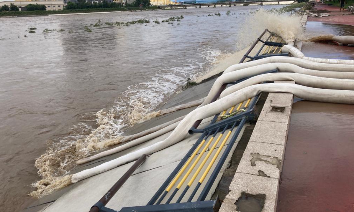 A residential area in Shangzhi is undergoing flood drainage on Aug. 6, 2023. Photo: Xinhua