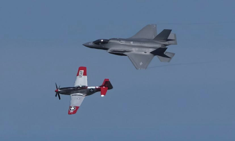 A U.S. Air Force F-35 Lightning II (upper) and a U.S. Air Force heritage aircraft make an aerial demonstration together during the 2023 Abbotsford International Airshow in Abbotsford, British Columbia, Canada, on Aug. 12, 2023. As one of the biggest airshows in Canada, the 2023 Abbotsford International Airshow takes place here from Aug. 11 to Aug. 13. (Photo by Liang Sen/Xinhua)