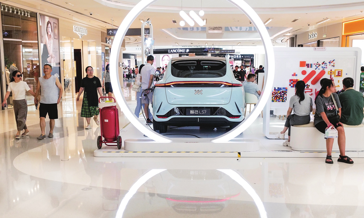 New-energy vehicles are on display on Shanghai Qibao Vanke Plaza on July 30, 2023. Photo: cnsphoto