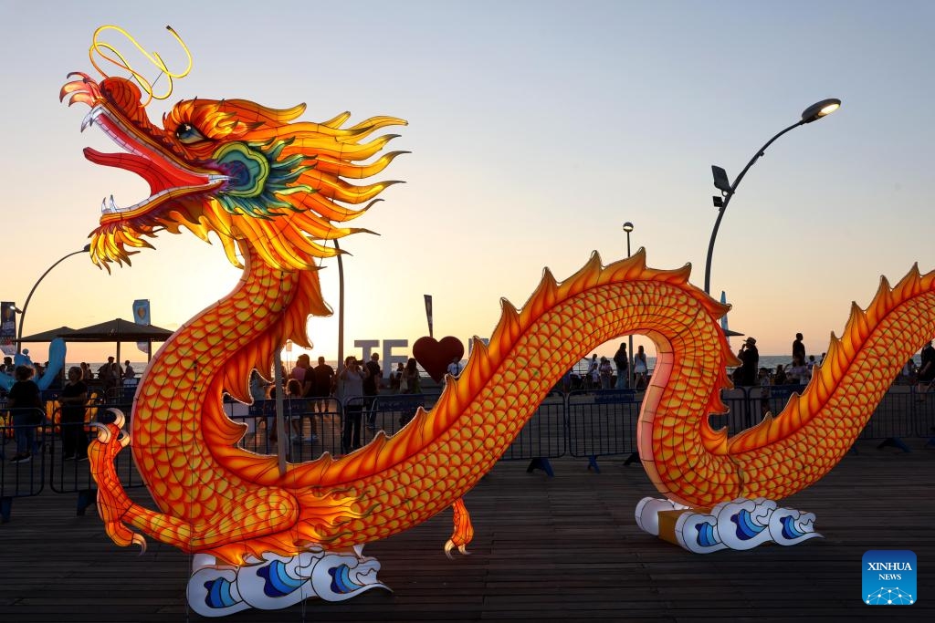 People visit the Chinese Lantern Exhibition in Tel Aviv, Israel, on Aug. 9, 2023. The Chinese Lantern Exhibition in Tel Aviv features several sets of lanterns which are crafted by a team from Zigong City of southwest China's Sichuan Province. (Photo: Xinhua)