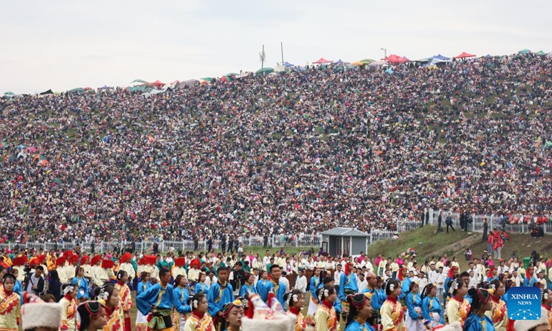 People watch the performance staged during the celebration event marking the 70th anniversary of the founding of Gannan Tibetan Autonomous Prefecture in Hezuo City, northwest China's Gansu Province, Aug. 10, 2023. A celebration event was held here to mark the 70th anniversary of the founding of Gannan Tibetan Autonomous Prefecture.(Photo: Xinhua)