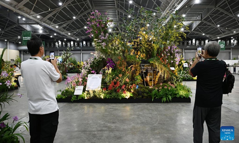 People visit the orchid show during the 14th Asia Pacific Orchid Conference in Singapore Expo, Singapore on Aug. 16, 2023. The 14th edition of the Asia Pacific Orchid Conference (APOC) is held from Aug. 16 to 20 at the Singapore Expo.(Photo: Xinhua)