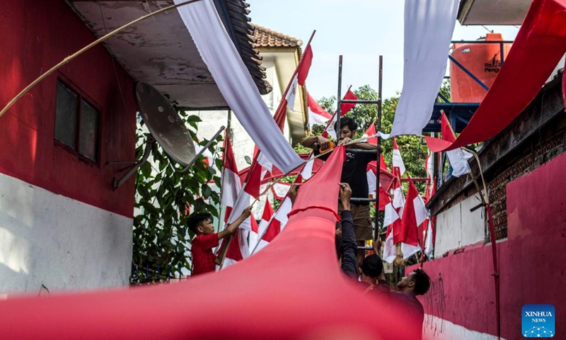 People set up decorations with elements of the Indonesian flag in a residential area ahead of the 78th Independence Day in Bandung, Central Java, Indonesia, Aug. 14, 2023. August 17 marks the Independence Day of Indonesia.(Photo: Xinhua)