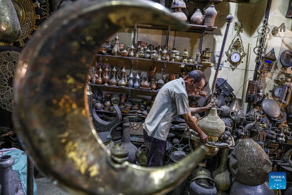 A shopkeeper works at a shop in Cairo, Egypt, on Aug. 13, 2023(Photo: Xinhua)