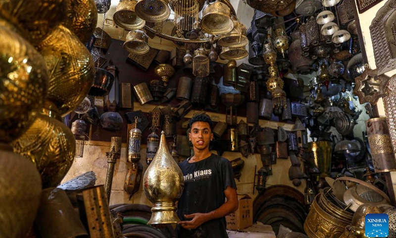 A shopkeeper works at a shop in Cairo, Egypt, on Aug. 13, 2023.(Photo: Xinhua)