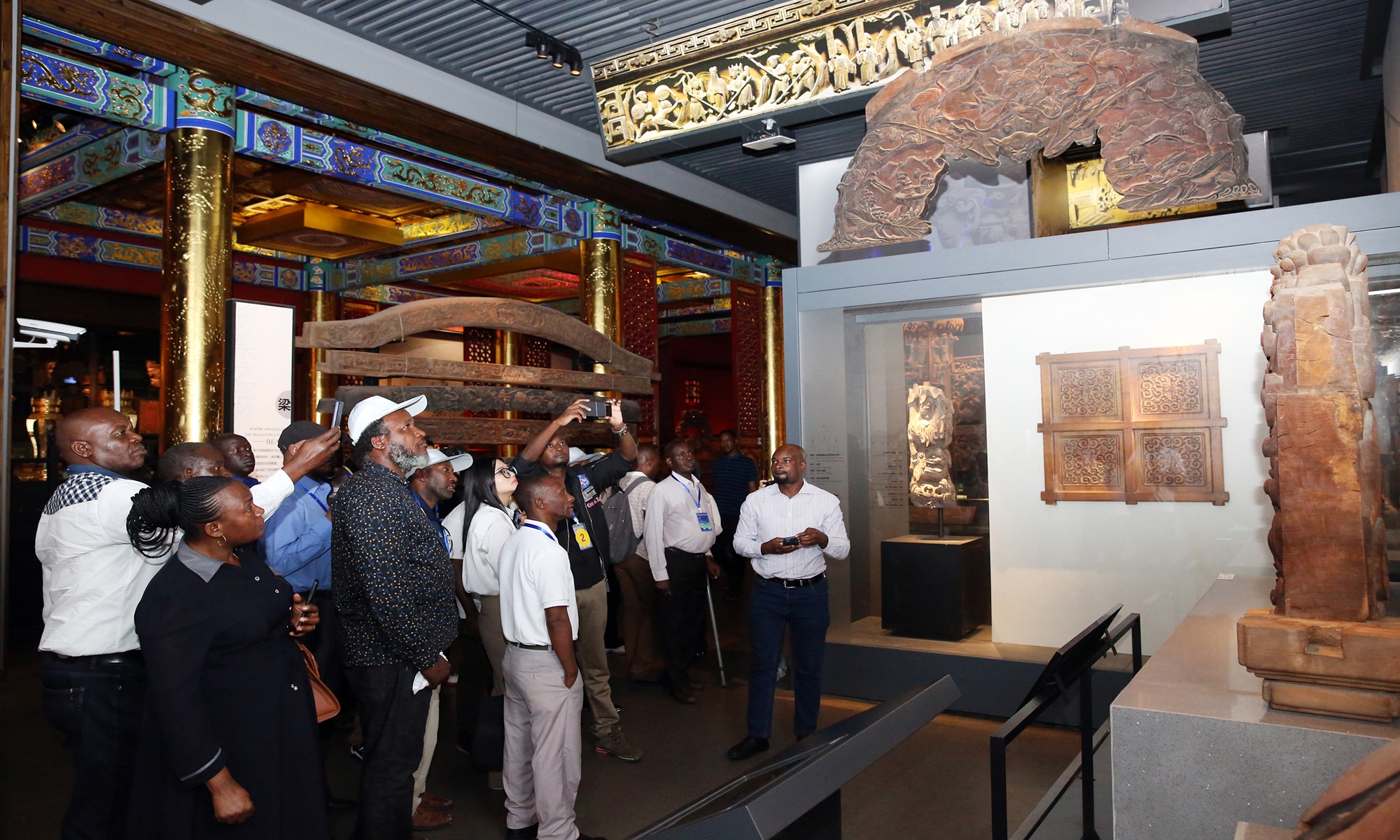 A team of more than 100 trade representatives from Tanzania visit a local woodcarving museum in Dongyang, East China's Zhejiang Province on August 16, 2023. The trip includes negotiations with local Chinese enterprises, with hopes to strengthen trade and economic cooperation with China. Photo: cnsphoto