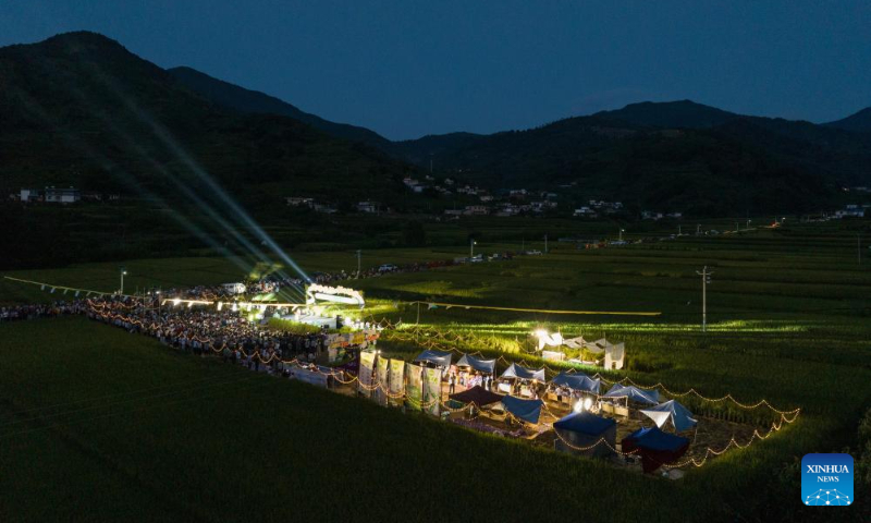 This aerial photo taken on Sept. 2, 2023 shows people taking part in a concert in Xinglong Village, Yanbian County of southwest China's Sichuan Province. (Xinhua/Jiang Hongjing)