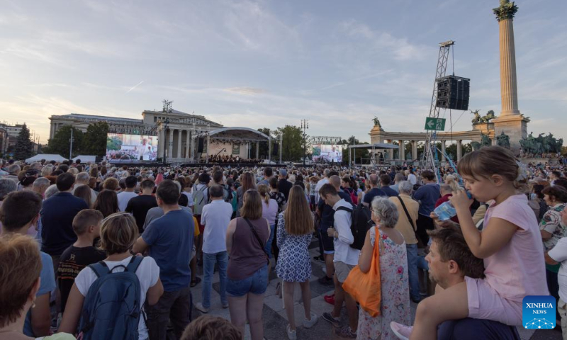 People listen to a free open air concert of the Budapest Festival Orchestra celebrating Budapest's 150th birthday on Heroes' square in Budapest, Hungary on Sept. 2, 2023. In 1873, Buda, Pest and Obuda were unified into one single city, naming the city Budapest. (Photo by Attila Volgyi/Xinhua)