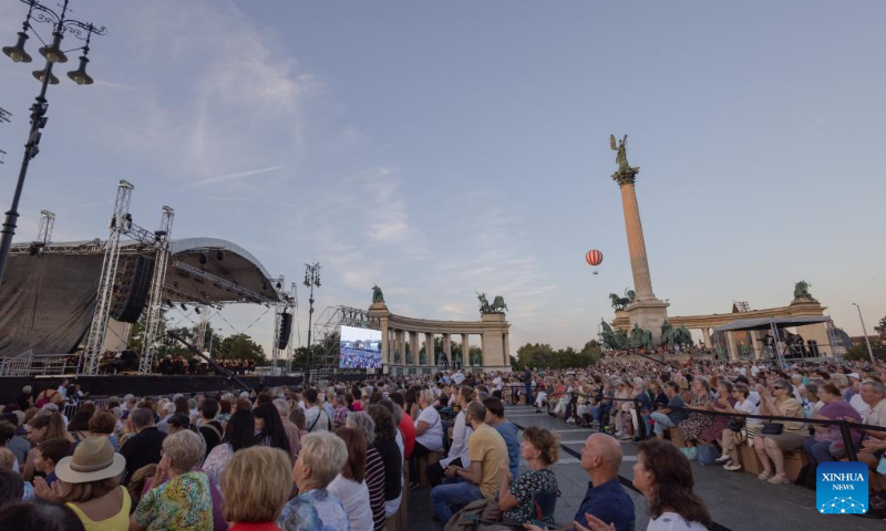 People listen to a free open air concert of the Budapest Festival Orchestra celebrating Budapest's 150th birthday on Heroes' square in Budapest, Hungary on Sept. 2, 2023. In 1873, Buda, Pest and Obuda were unified into one single city, naming the city Budapest. (Photo by Attila Volgyi/Xinhua)