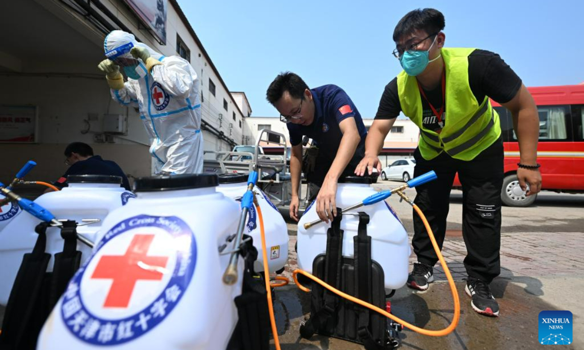 Staff members carry out disinfection at Taitou Town of Jinghai District, north China's Tianjin Municipality, Aug 17, 2023. Some areas in Tianjin were affected by floods in the aftermath of recent heavy rainfall brought by Typhoon Doksuri. At present, the local authorities are conducting environmental disinfection to prevent epidemics after the floods. Photo:Xinhua