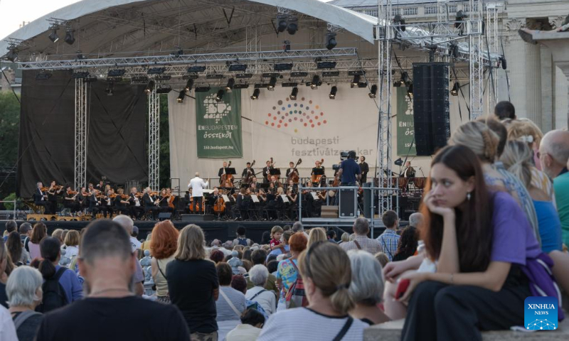 People listen to a free open air concert of the Budapest Festival Orchestra celebrating Budapest's 150th birthday on Heroes' square in Budapest, Hungary on Sept. 2, 2023. In 1873, Buda, Pest and Obuda were unified into one single city, naming the city Budapest. (Photo by Attila Volgyi/Xinhua)