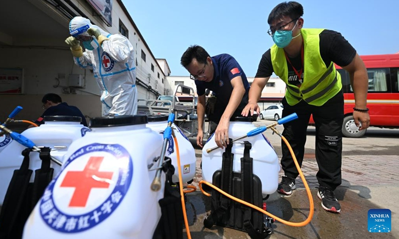 Staff members carry out disinfection at Taitou Town of Jinghai District, north China's Tianjin Municipality, Aug. 17, 2023. Some areas in Tianjin were affected by floods in the aftermath of recent heavy rainfall brought by Typhoon Doksuri. At present, the local authorities are conducting environmental disinfection to prevent epidemics after the floods.(Photo: Xinhua)