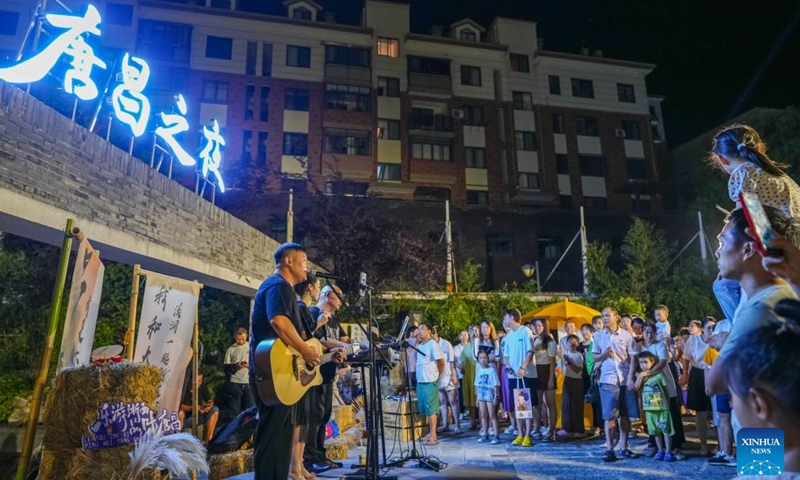 Artists perform during a cultural festival in Changhua Town of Hangzhou City, east China's Zhejiang Province, Aug. 18, 2023. The cultural festival, which kicked off Friday in Changhua Town, aimed to boost the nighttime economy by presenting the culture of Tang (618-907) and Song (960-1279) Dynasties and promoting local snacks and scenic spots. (Xinhua/Xu Yu)